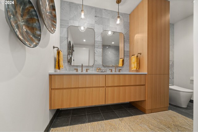 590 Waterfront Way Unit 202, Vancouver, WA 98660 - full bathroom featuring tile patterned flooring, a sink, double vanity, and toilet