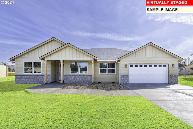 view of front facade with a front yard and a garage