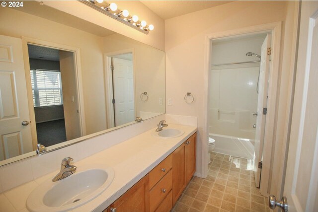 full bathroom featuring shower / tub combination, toilet, and vanity