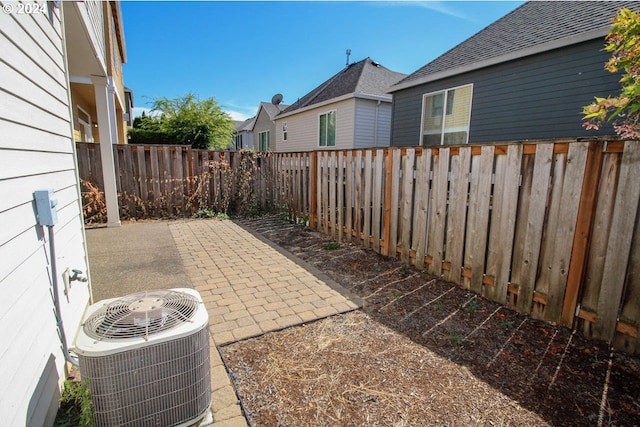 exterior space featuring cooling unit and a patio