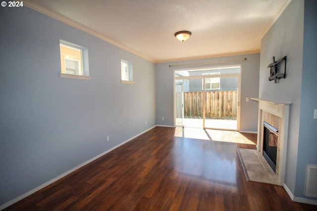 unfurnished living room with a fireplace, dark hardwood / wood-style floors, and ornamental molding