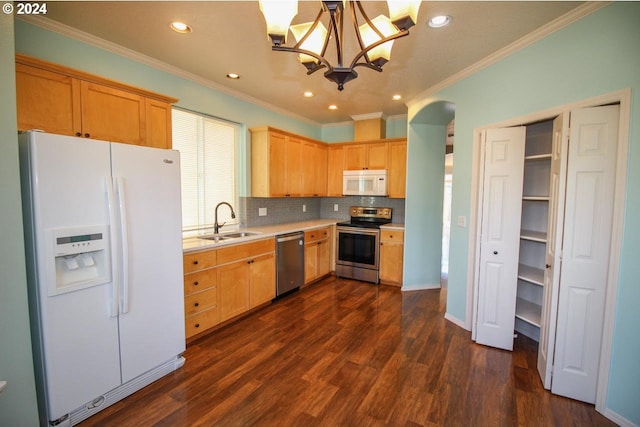 kitchen with dark hardwood / wood-style flooring, an inviting chandelier, sink, hanging light fixtures, and appliances with stainless steel finishes