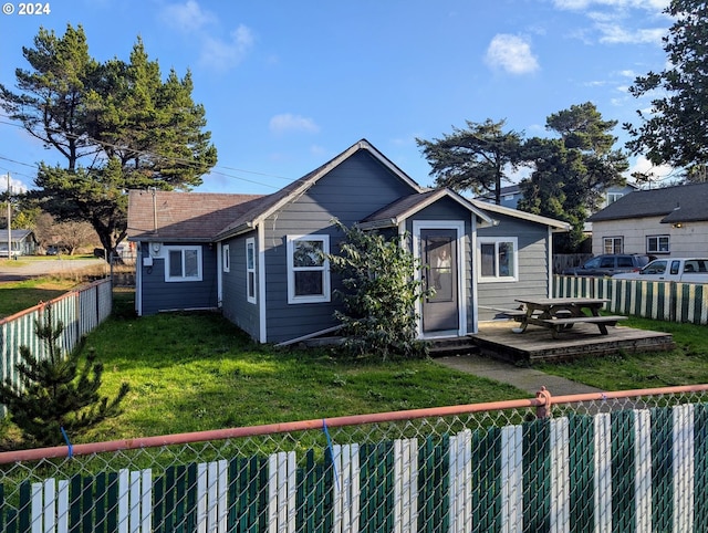 bungalow with a patio area and a front lawn