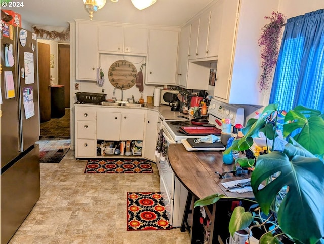 kitchen featuring white cabinets, white appliances, and sink