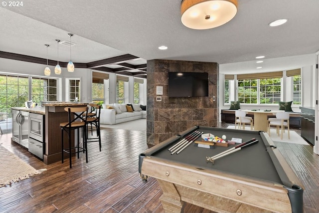 game room with billiards, dark hardwood / wood-style flooring, and plenty of natural light