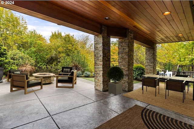 view of patio / terrace featuring an outdoor living space with a fire pit