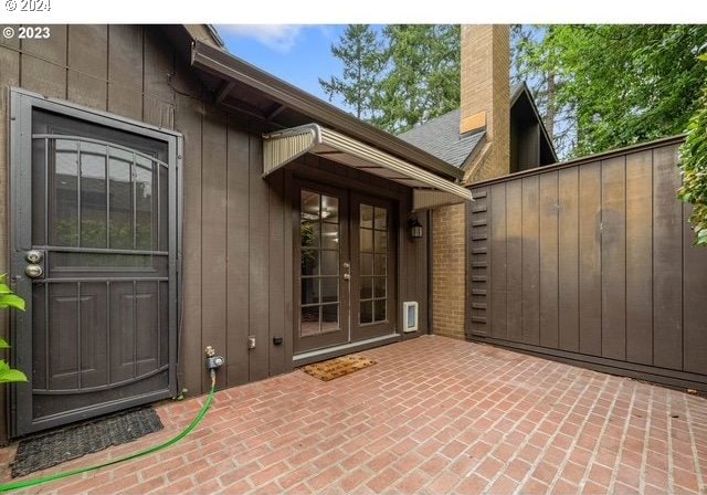 doorway to property with a patio and french doors