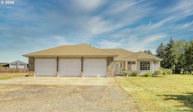 view of front facade featuring a front lawn and a garage