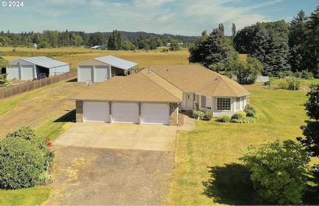 view of front of property with a front lawn and a garage