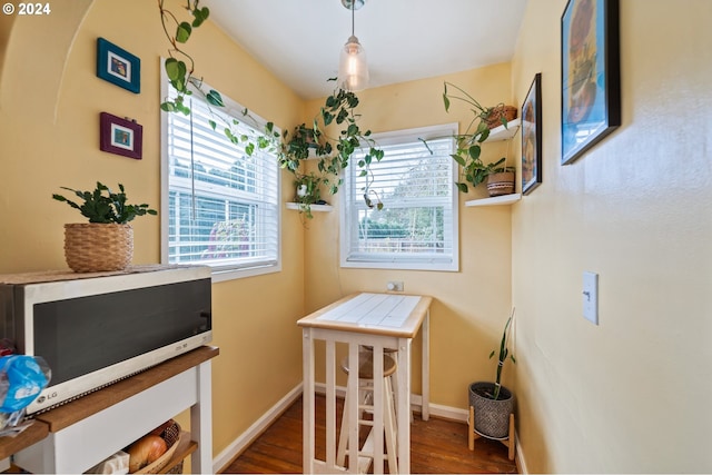 dining area featuring dark hardwood / wood-style floors