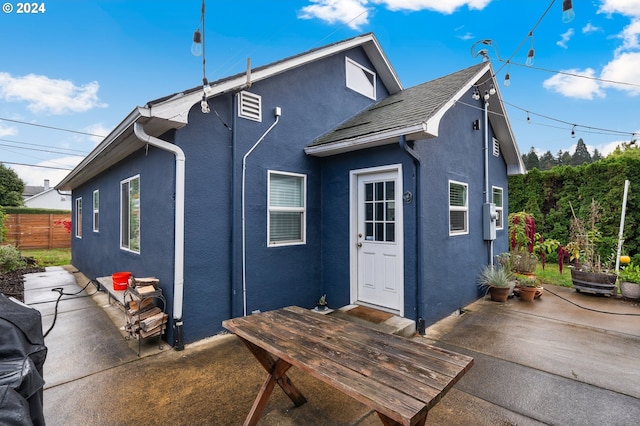 rear view of house featuring a patio area