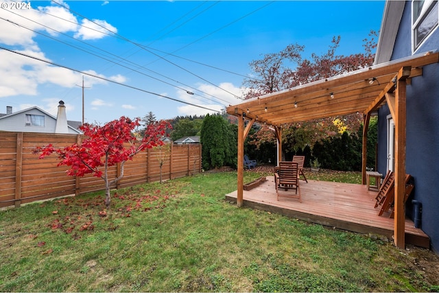 view of yard with a pergola and a wooden deck