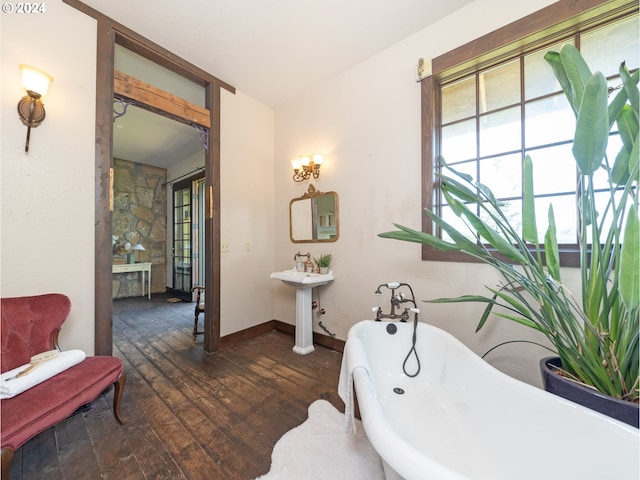 bathroom featuring a bathtub and hardwood / wood-style flooring