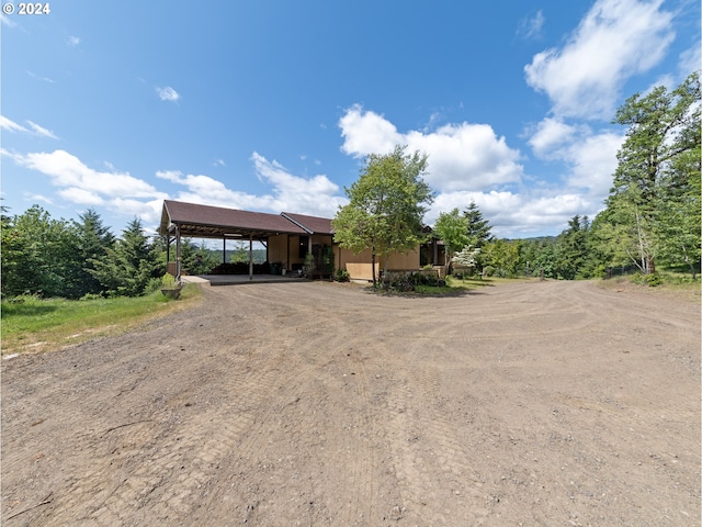 view of front of home featuring a carport