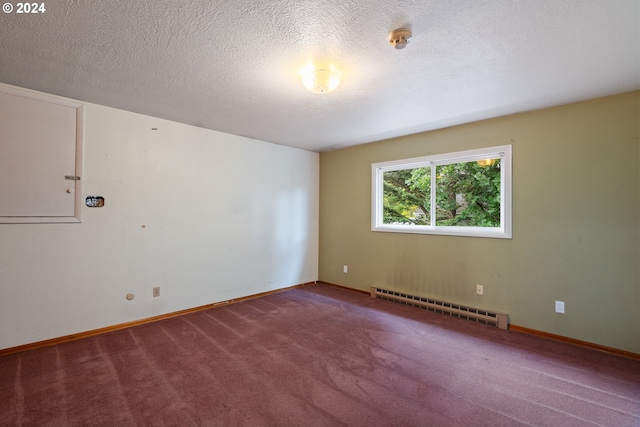 unfurnished room with a textured ceiling, carpet floors, and baseboard heating