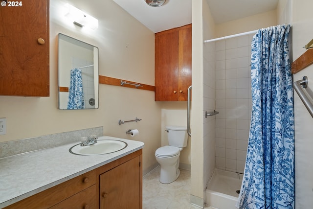 bathroom featuring vanity, toilet, and walk in shower