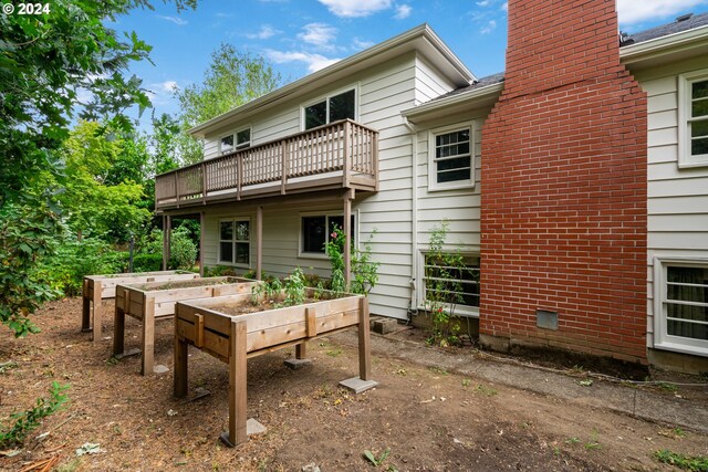 rear view of house with a balcony