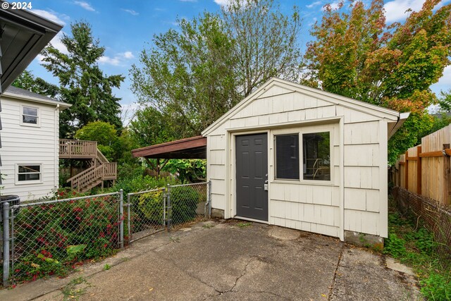 view of outbuilding with a carport