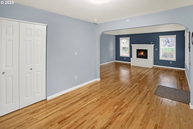 unfurnished living room featuring light hardwood / wood-style floors