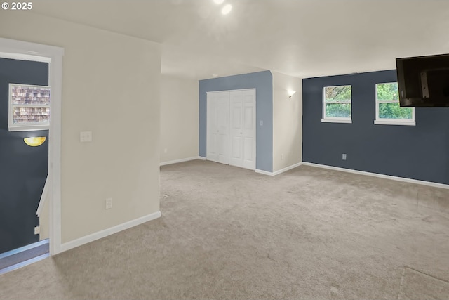 empty room featuring light colored carpet