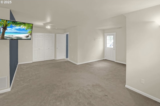 unfurnished living room with carpet floors