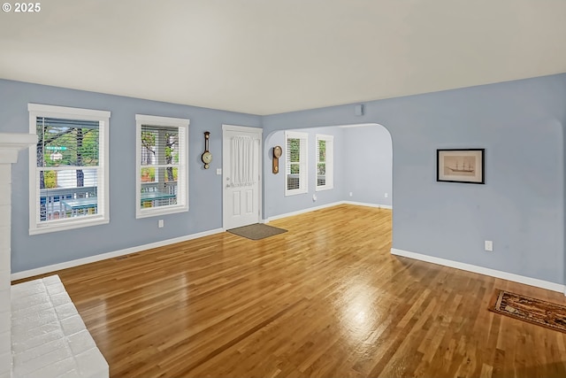 unfurnished living room featuring light hardwood / wood-style flooring