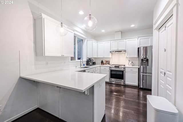 kitchen with kitchen peninsula, white cabinetry, hanging light fixtures, and appliances with stainless steel finishes