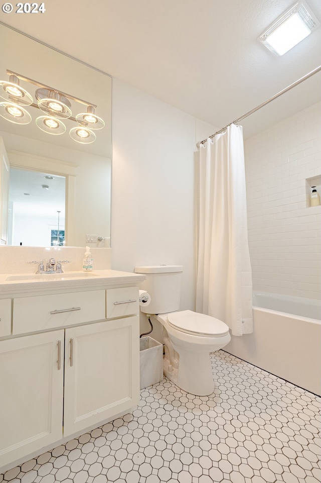 full bathroom with vanity, toilet, and shower / bath combo with shower curtain