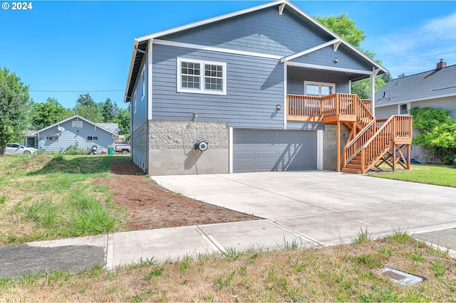 view of front facade with a front yard and a garage