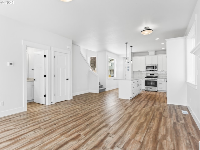 unfurnished living room featuring light hardwood / wood-style flooring