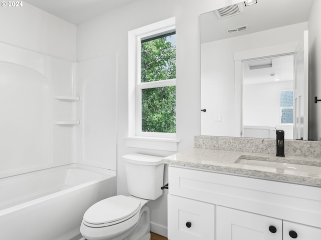 full bathroom with vanity, toilet, and bathtub / shower combination