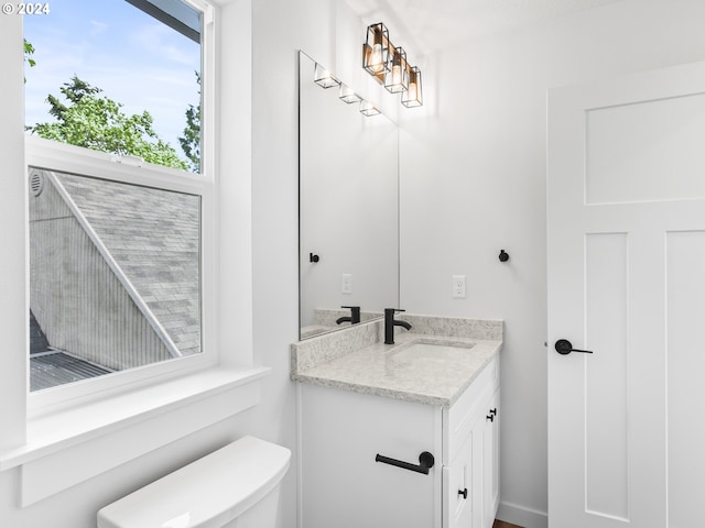 bathroom with vanity and toilet