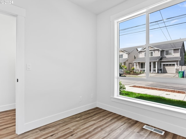 spare room featuring hardwood / wood-style floors