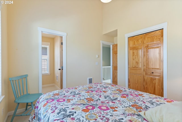 carpeted bedroom with a closet