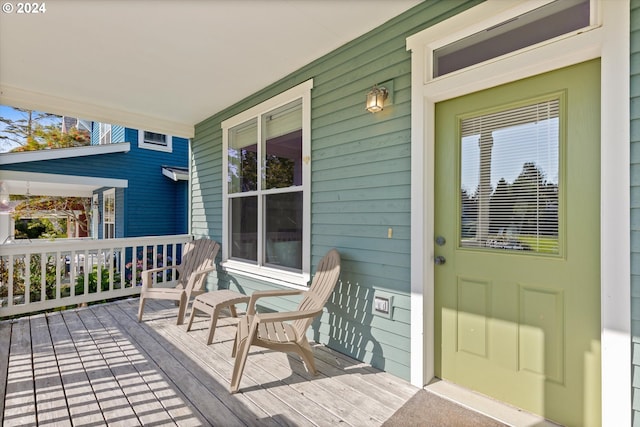 wooden terrace with a porch