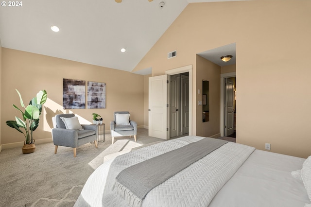 carpeted bedroom featuring high vaulted ceiling