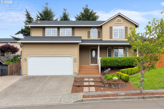 4033 SE 199th Ave, Camas, WA 98607 - traditional home with concrete driveway, an attached garage, fence, and a porch