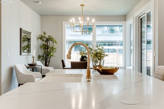 dining area with an inviting chandelier