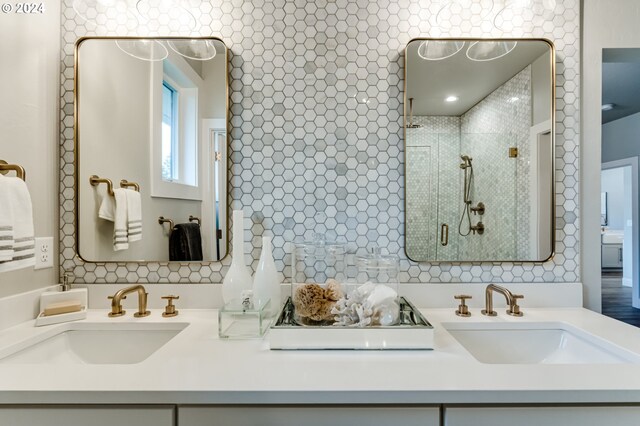 bathroom featuring vanity and a shower with shower door