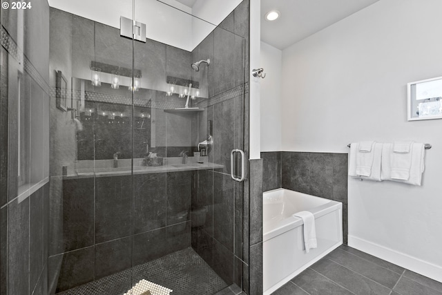 bathroom with tile flooring and plus walk in shower