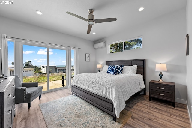 bedroom featuring access to outside, ceiling fan, wood-type flooring, and a wall unit AC