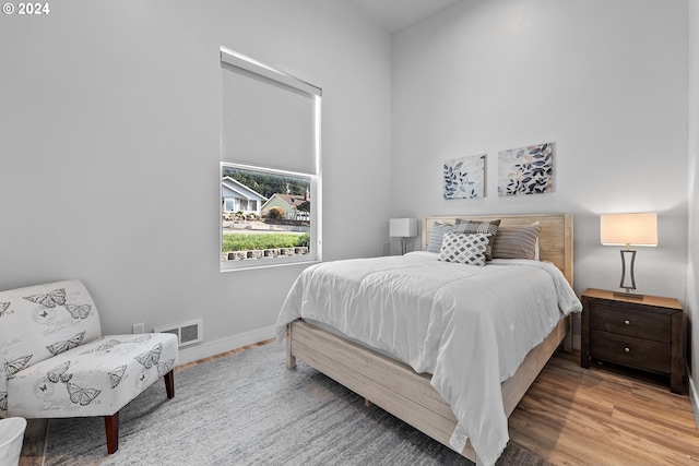 bedroom with light hardwood / wood-style floors