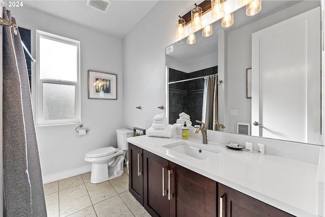 bathroom featuring oversized vanity, toilet, and tile flooring