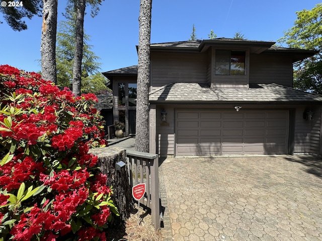 view of side of home featuring a garage