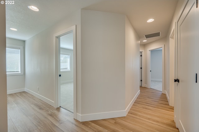 corridor featuring light wood-type flooring