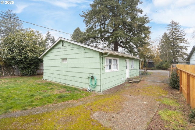 view of property exterior with a yard