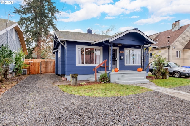 bungalow featuring central AC unit