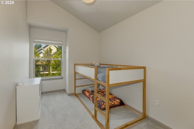 carpeted bedroom with vaulted ceiling