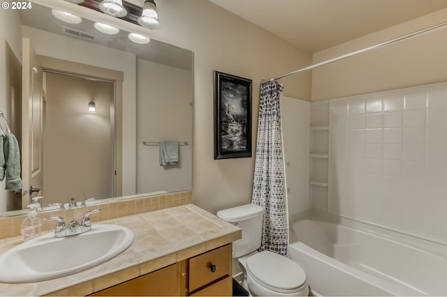 full bathroom featuring toilet, vanity, and shower / tub combo