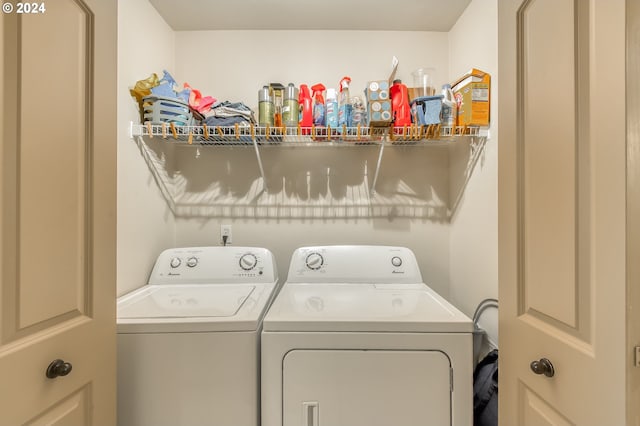 clothes washing area featuring washer and dryer